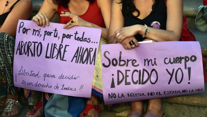 Pro-abortion activists stage a protest in front of the presidential palace in Santiago, Chile, on Nov. 11, 2014.