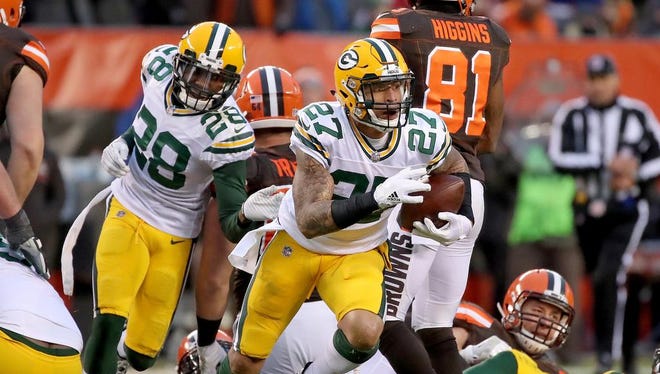Green Bay Packers strong safety Josh Jones (27) emerges from the pile with the intercepted ball in overtime against the Cleveland Browns on Dec. 10, 2017 at FirstEnergy Stadium in Cleveland.