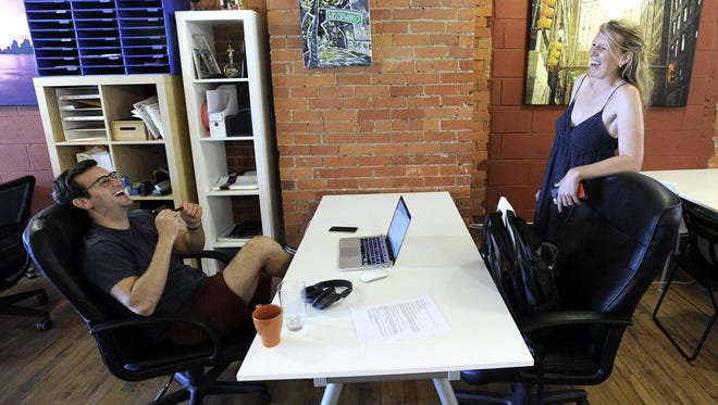 Northwestern University graduate student David Visintainer and Amy Sacka, a freelance copy writer and street photographer, co-work at Bamboo Detroit. Both are from Detroit.