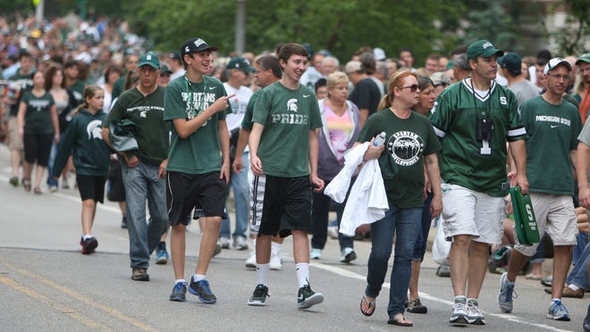 Fans arrive for the Michigan State vs. Jacksonville State football game Aug. 29, 2014, at Spartan Stadium in East Lansing.