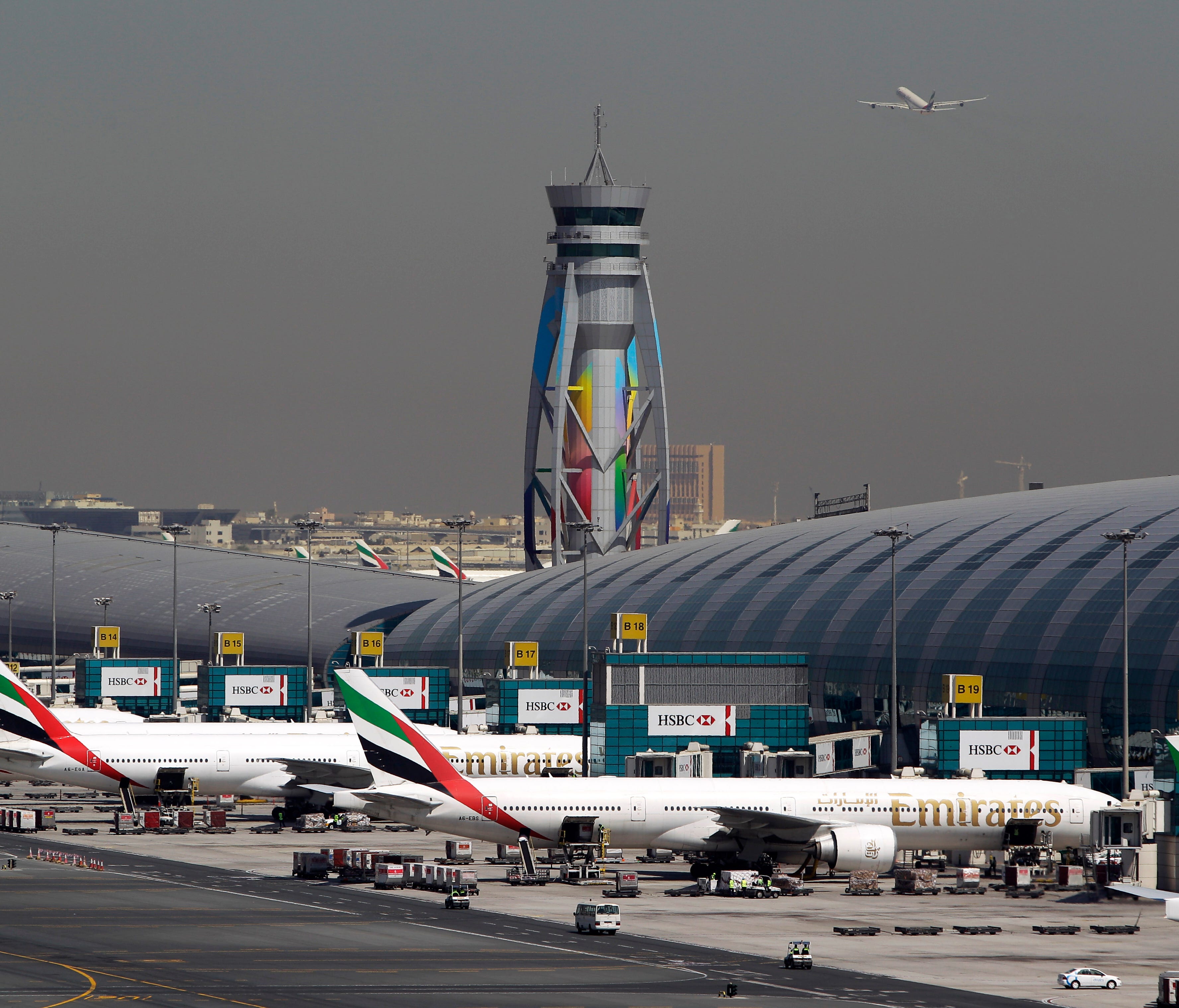 This file photo from May 8, 2014, shows Emirates passenger planes at gates at the Dubai International Airport in the United Arab Emirates.