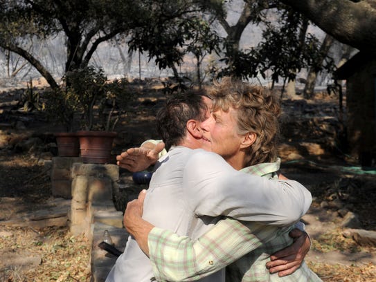 Sage Joyner hugs Karin Dron, who lives on Gridley Road