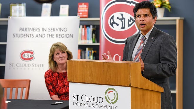 St. Cloud State University Interim President Ashish Vaidya, left, and St. Cloud Technical & Community College Interim PresidentÊLori Kloos talk about the new partnership agreement between the two schools Wednesday, July 12, at SCTCC. 
