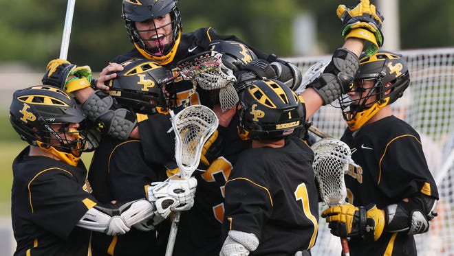 Lakeland/Panas' players celebrate a goal by Sean Makar (2) against Valley Central in the state Class A regional lacrosse championship game at Dietz Stadium in Kingston June 4, 2016. Lakeland/Panas won the game 13-7.