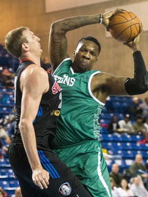 Delaware 87ers center Tiny Gallon collides with Springfield Armor's Jeff Foote in the first quarter at the Bob Carpenter Center in Newark last April.