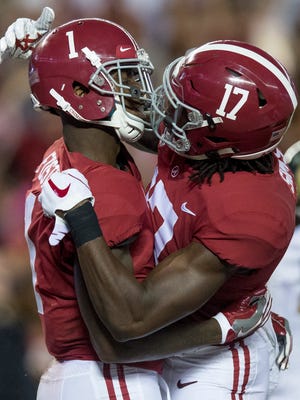 Alabama wide receiver Robert Foster (1) and Alabama wide receiver Cam Sims (17) celebrate after Foster's touchdown at Bryant-Denny Stadium in Tuscaloosa, Ala., on Saturday September 16, 2017.