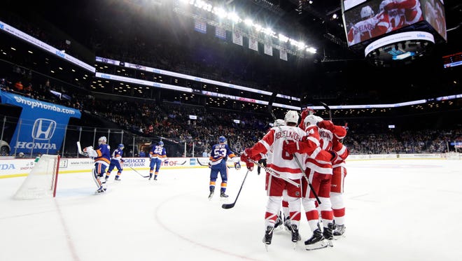 The Red Wings celebrate a goal by Gustav Nyquist during the first period against the Islanders on Tuesday in New York.