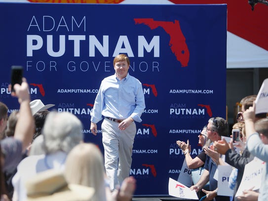 Florida Agriculture Commissioner Adam Putnam walks out to greet his supporters during his campaign rally as he kicks off his gubernatorial campaign at the Old Polk County Courthouse in Bartow, Fla., Wednesday, May 10, 2017.