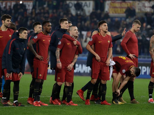Roma players celebrate their victory at the end of the group C Champions League soccer match between Roma and Qarabag at the Stadio Olimpico in Rome, Italy, Tuesday, Dec. 5, 2017. (AP Photo/Alessandra Tarantino)