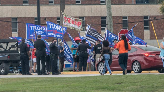 A small group of supporters for President Donald Trump gather on the Savannah State University campus during last Monday's Jill Biden rally.