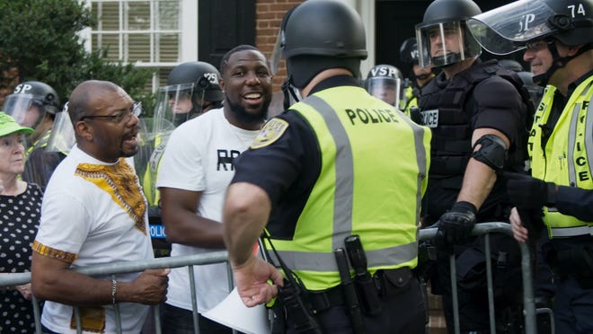Filmmaker Ben Rekhi's documentary "The Reunited States' will make its world premiere at the virtual Woods Hole Film Festival. In this scene, citizens and police share a moment on the first anniversary of the Unite the Right Rally in Charlottesville on Aug. 12, 2018.