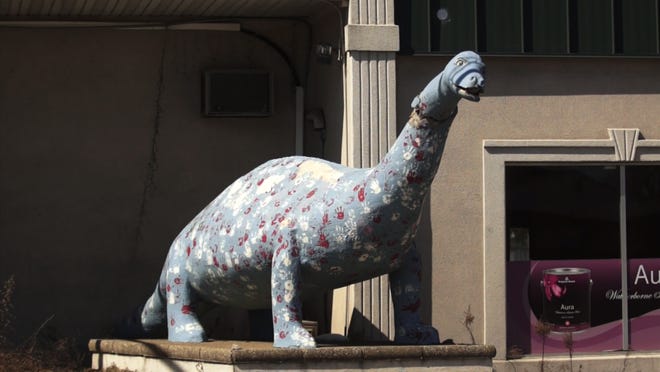 The Bayville dinosaur has stood sentinel over Route 9 for more than eight decades, enduring at least two decapitations, along with the indignity of once being painted purple and green.