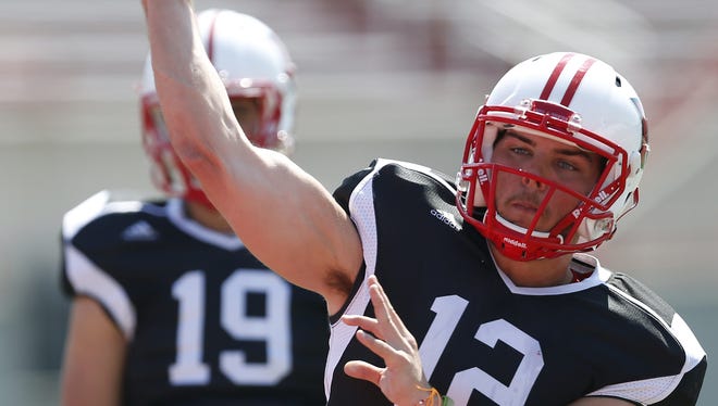 Miami University quarterback Andrew Hendrix works out during practice at Yager Stadium The Enquirer/Jeff Swinger