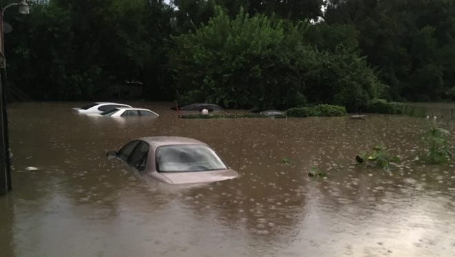 Backyards flood near East Mitchell Avenue and Vine Street in Cincinnati Sunday evening.