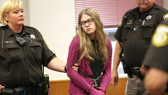 Morgan Geyser of Waukesha, Wis., accused along with her friend, Anissa Weier, of stabbing their sixth-grade classmate on May 31, 2014, in hopes of appeasing a fictional Internet character called Slender Man, is led Sept. 21, 2015, into a Waukesha County Circuit courtroom for a hearing. Here she looks toward where her parents are seated in the gallery.
