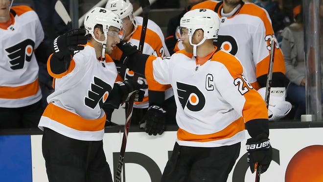 Shayne Gostisbehere, left, and Claude Giroux are both skating better this season, which has helped the team's speed.