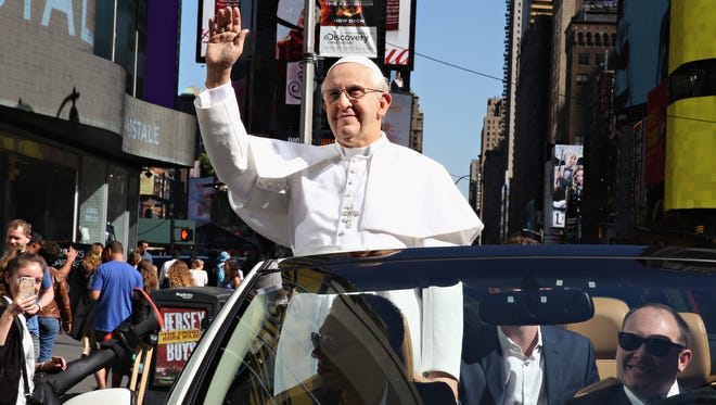 Madame Tussauds New York unveils a never-before-seen Pope Francis figure with a tour around New York City in a 'Pope Mobile' to celebrate the Pope's inaugural U.S. visit on September 24, 2015 in New York City.