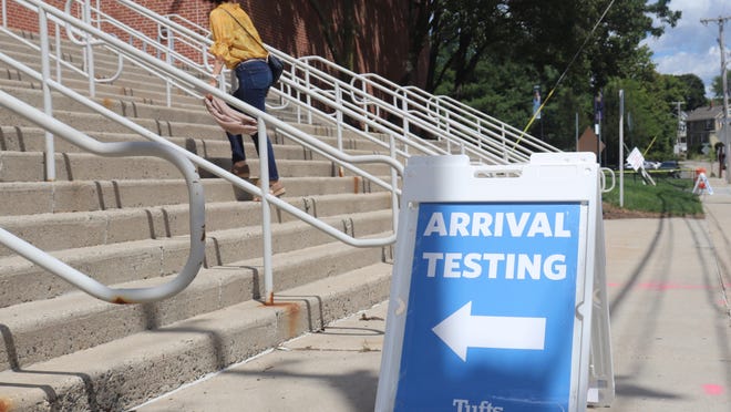 A newly A newly arrived Tufts student walks up the steps to the Gantcher Center in Medford to receive a coronavirus test on Aug. 31, 2020. As of Aug. 28, 10,270 tests have been administered for the university's faculty, staff and students.