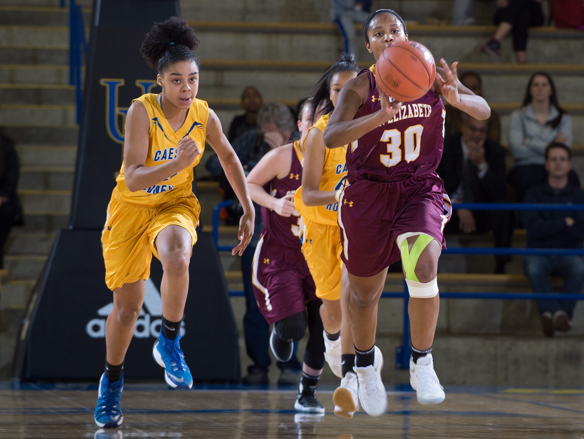 St. Elizabeth’s Alanna Speaks (30) passes the ball down the court in their win against Caesar Rodney in the quarterfinals of DIAA Girls Basketball Tournament at the University of Delaware.