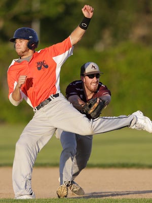The Menasha Macs' #14 Nathan Jack is tagged out between first and second by Appleton Legends's #20 Jordan Plamann during the second annual Cancer Benefit Baseball Game on June 23, 2015, in Menasha, Wis.Wm.Glasheen/Post-Crescent Media