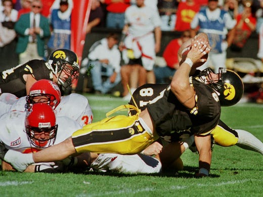 Iowa's Tim Dwight falls into end zone in the third quarter for the fourth Iowa touchdown of the game against Iowa State on Sept. 14, 1996, in Iowa City.