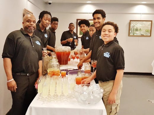 100 Black Men of Knoxville Vice President and Mentoring Chairman Rick Staples with mentees serving a recent event, from left, Zion Olum, Kalen Jones, Bryce Logan, Eunique Valentine, Michael Darden, Kylan Campbell and Julian Posey.
