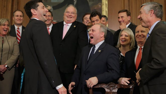 House Speaker Paul Ryan, front left, with fellow Republican representatives after signing legislation to repeal the Affordable Care Act on Jan. 7, 2016.