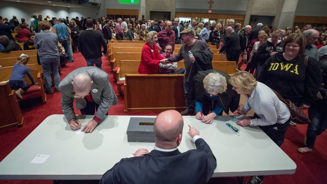 Caucusgoers cast their ballots at Gloria Dei Lutheran Church during the Iowa caucuses on Feb. 1, 2016.