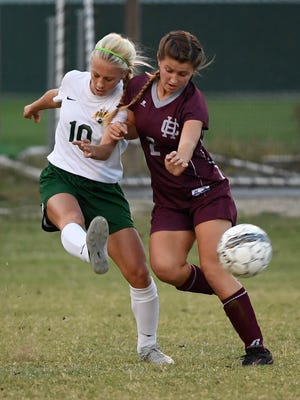 University Heights' Lilly Strader (left) and Henderson's Madi Tompkins battle in last year's Second Region Tournament at Colonel Field.