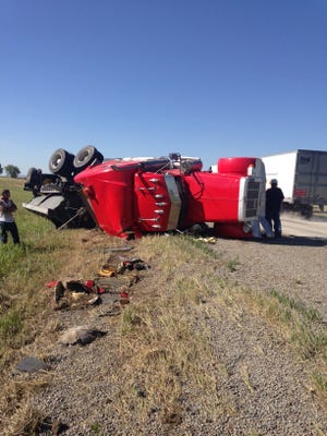 A semi flipped onto its side Thursday morning north of Fort Collins.