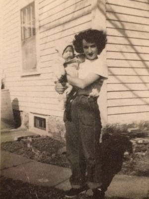 Mary Stickney holds her son, Ken, in Gloucester, Massachusetts in 1954.