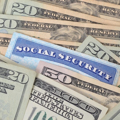 Social Security card embedded in a spread out pile