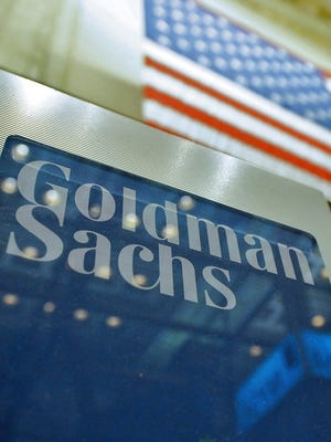 January 2011 file photo shows a sign at the Goldman Sachs booth on the floor of the New York Stock Exchange in New York City.