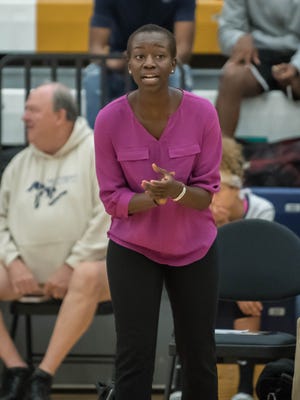 Battle Creek Central varsity volleyball coach Winnie Lejukole encourages her team during a match against Lakeview on Wednesday.