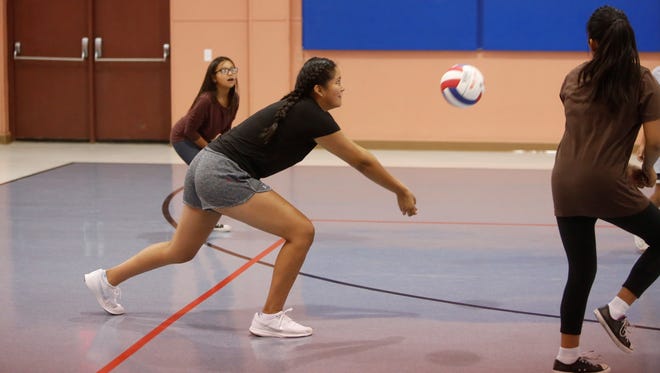 Recent Kirtland Central graduate Nia Nelson passes the ball during Friday's volleyball camp session at the Walter Collins Center in Upper Fruitland, which is just outside Kirtland.