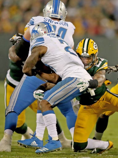 Green Bay Packers safety Josh Jones (27) tackles running