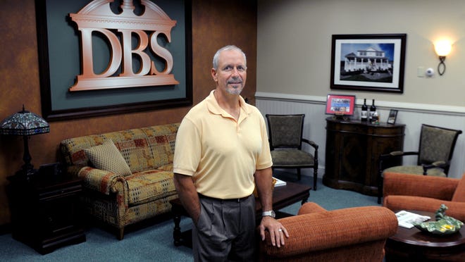 Brian Altmann, 51, president of DBS Remodel, stands in the lobby of his company's office on Route 55 in the Town of LaGrange. Altmann has been in business for 28 years.