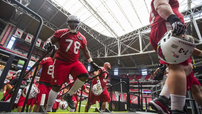 Cardinal's Earl Watford (78) comes up the stairs to the field during the team's first practice at University of Phoenix Stadium on July 29, 2016 in Glendale, Ariz.