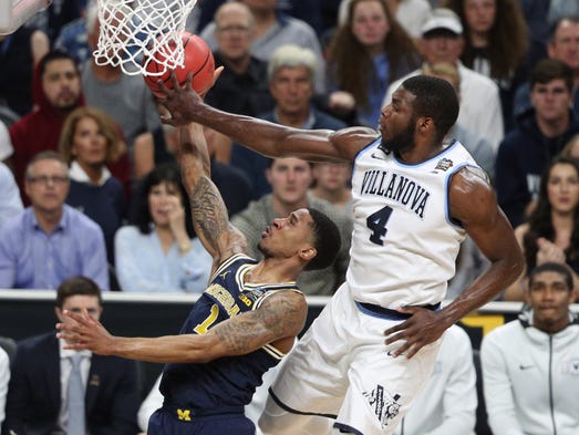 Villanova Wildcats forward Eric Paschall (4) blocks