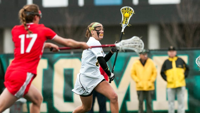 Vermont's Jessica Roach (21) looks to take a shot during the women's lacrosse game between the Stony Brook Sea Wolves and the Vermont Catamounts at Virtue Field last season.