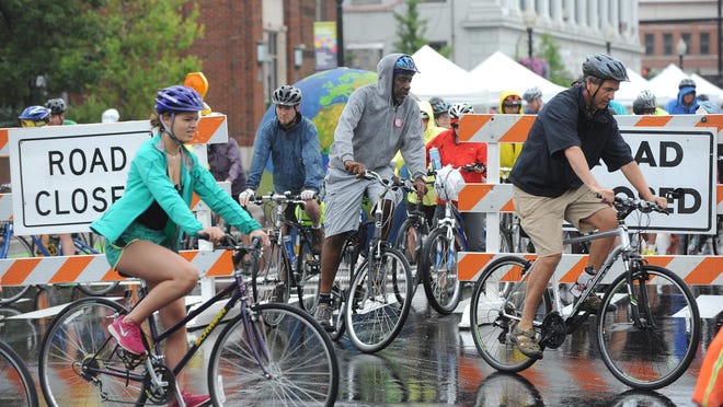 Bike riders brave light rain at the start of the 2015 Sierra Club Green Cruise, Saturday, for a 22-mile bike ride to Birmingham and back.