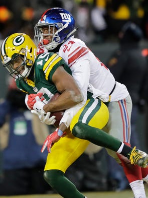 Green Bay Packers wide receiver Randall Cobb (18) scores