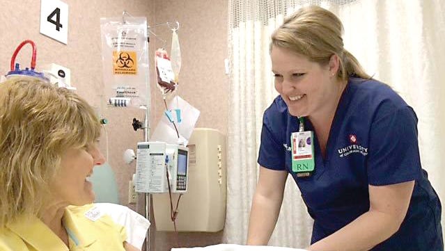 Bree Anderson: Registered nurse Bree Anderson talks with patient Sandra Conaway at Poudre Valley Hospital in Fort Collins. PVH was recognized earlier this month as one of the nation’s
100 Top Hospitals by Truven Health Analytics. Kati Blocker / University of Colorado Health.