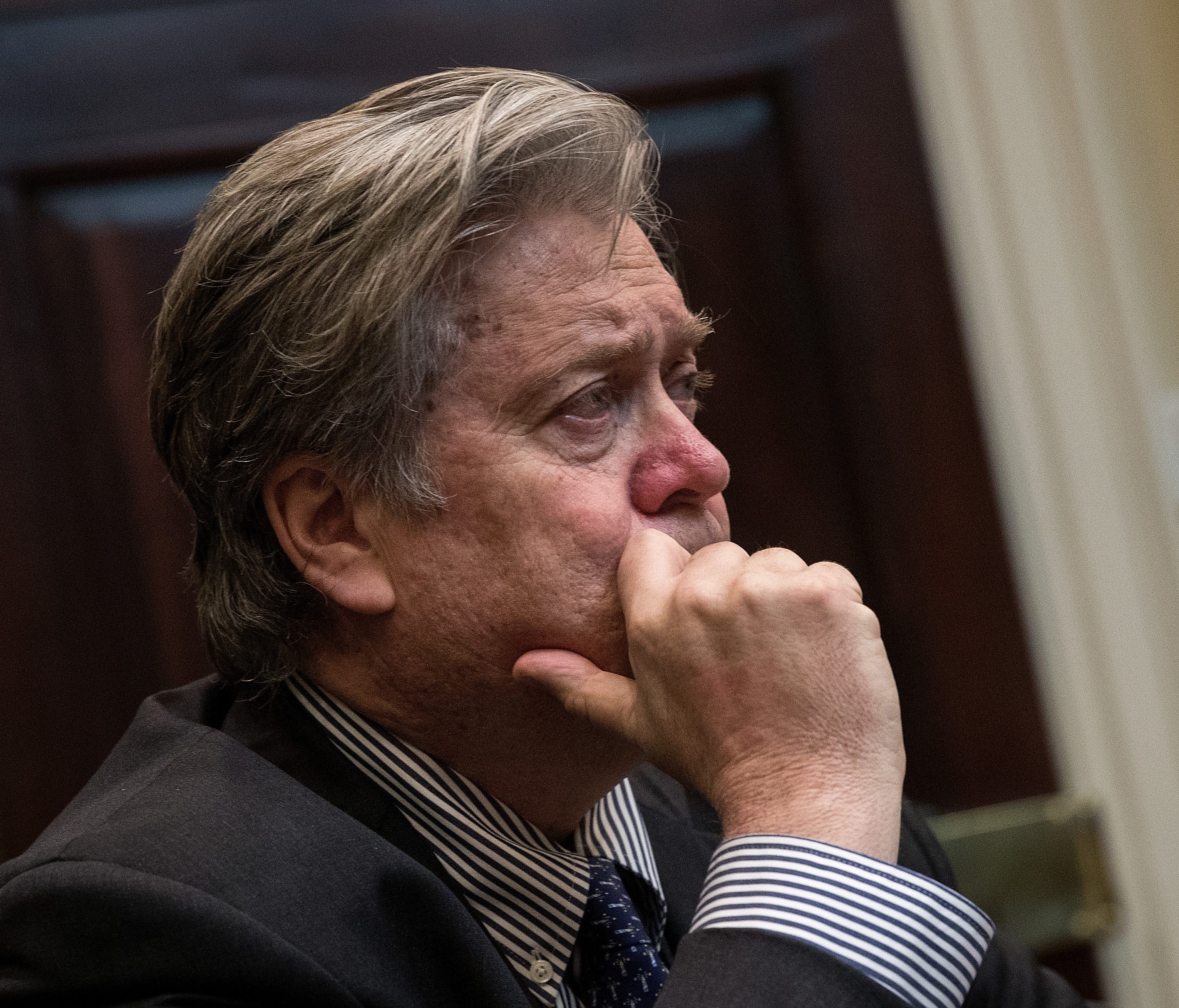 WASHINGTON, DC - FEBRUARY 2: (AFP OUT) White House Chief Strategist Steve Bannon looks on as President Donald Trump meets with Senate and House legislators, in the Roosevelt Room at the White House, February 2, 2017 in Washington, DC. Lawmakers inclu