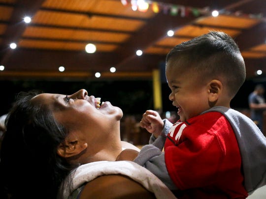 Adalicia Montecinos holds her year-old son Johan, who