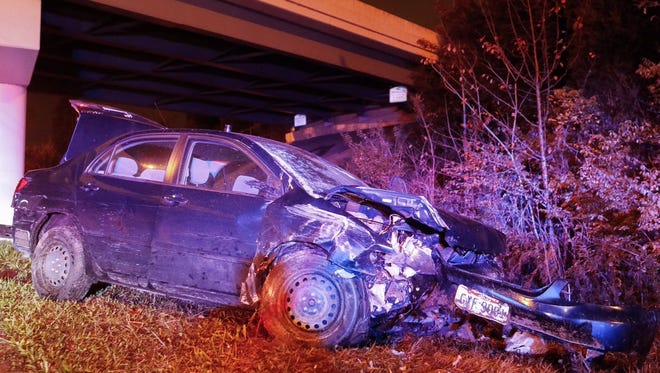 A man is hospitalized after his car went off of an I-74 overpass, police said.