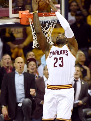 Cleveland Cavaliers forward LeBron James dunks against the Toronto Raptors during the first half of Game 2 of the Eastern Conference finals.