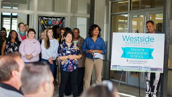 Westside Elementary staff watch the school's ribbon-cutting ceremony on Aug. 6, 2018.