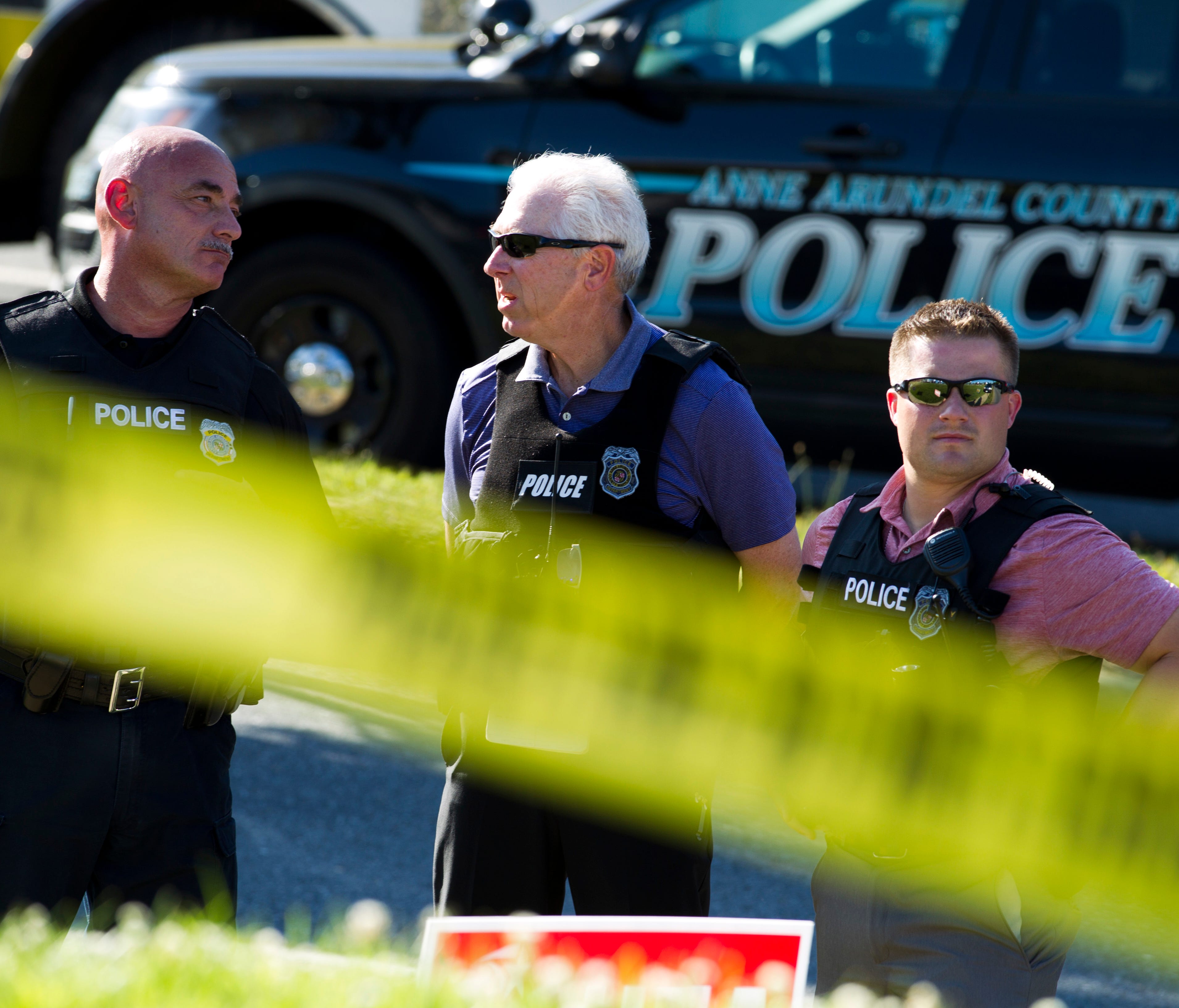 Police officers secure the area after multiple people were shot at an office building housing The Capital Gazette newspaper in Annapolis, Md. on June 28, 2018.