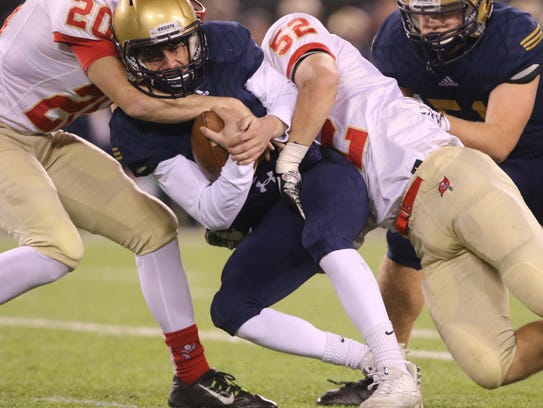 Nick McNerney of Old Tappan holds onto the ball as